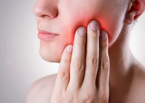 Why Does My Gum Hurt in One Spot? Reasons & Fixes 2026