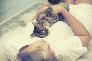 Why Does My Cat Sleep on My Chest? What It Means 2026