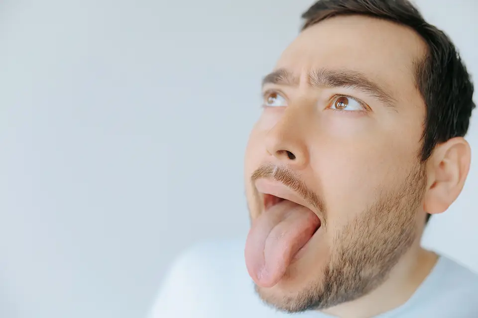 Why Does the Back of My Tongue Hurt? Possible Causes 2026