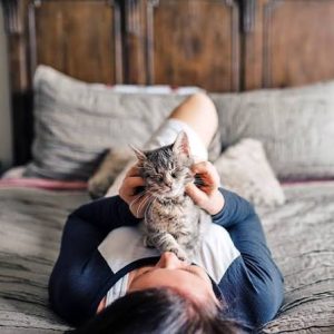 Why Do Cats Sleep on Your Chest? Signs They Trust You 2026